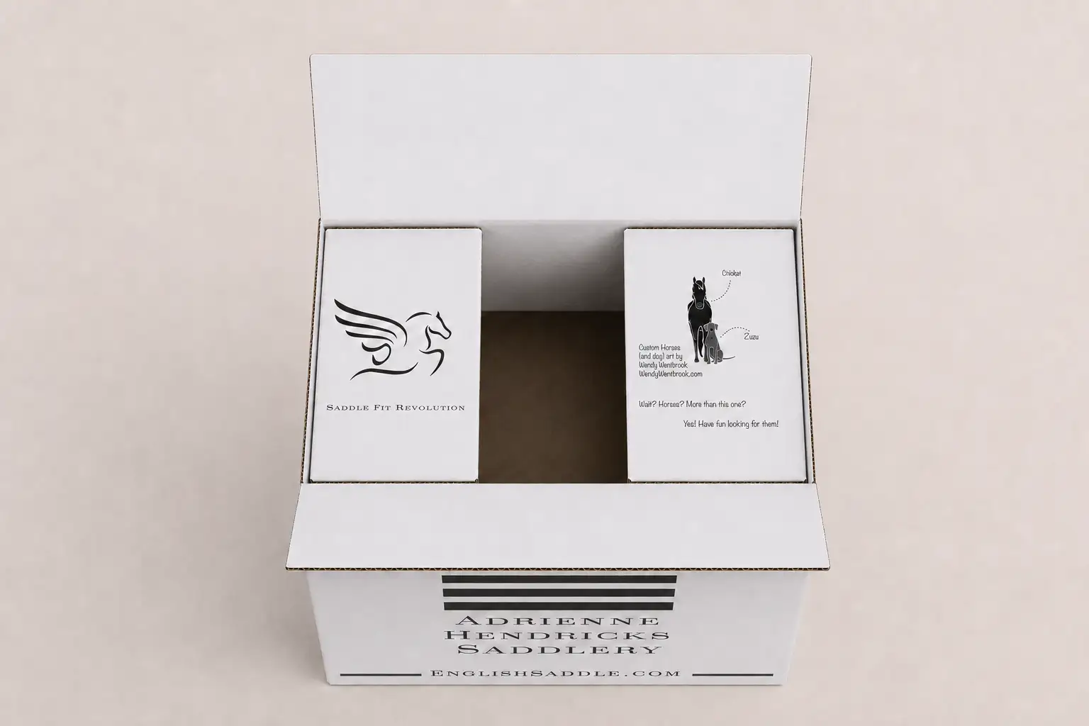 Inside flaps of the Adrienne Hendricks Saddlery box featuring pegasus and horse illustrations