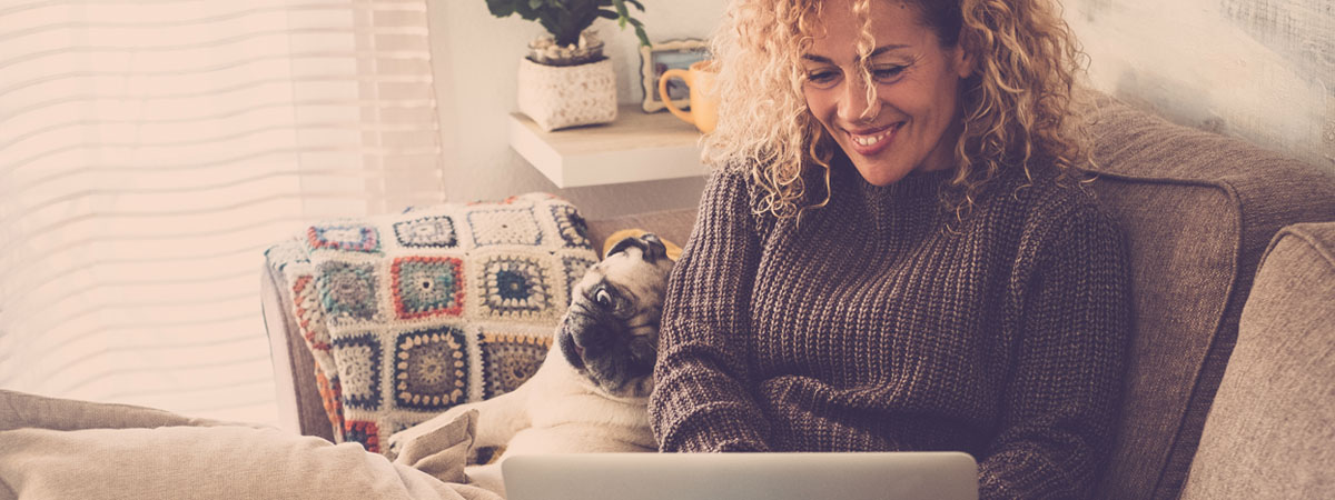 woman with laptop and dog